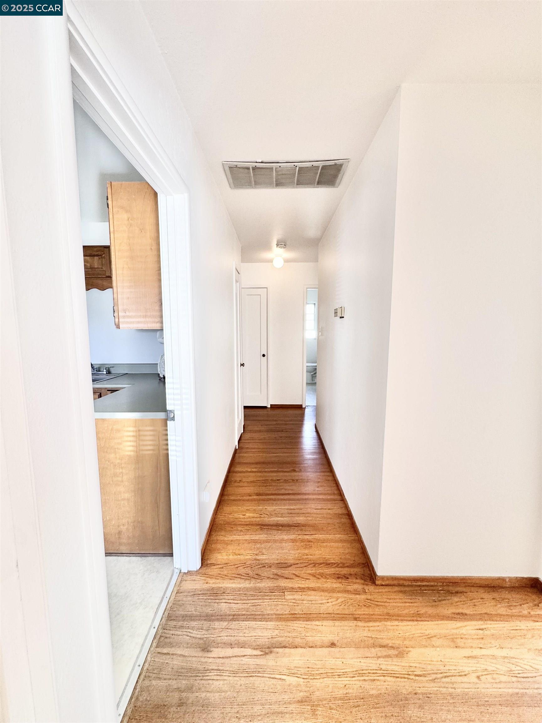 1834 Venice Drive Concord, CA 94519 - Photo 15 of 25 a view of a hallway with wooden floor