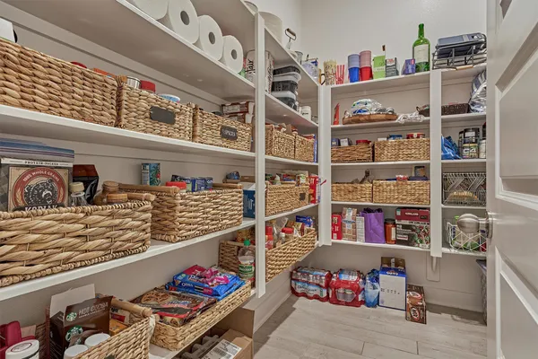 a large kitchen with kitchen island a sink table and chairs