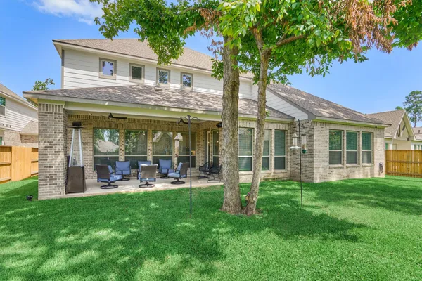 a front view of a house with a garden and porch
