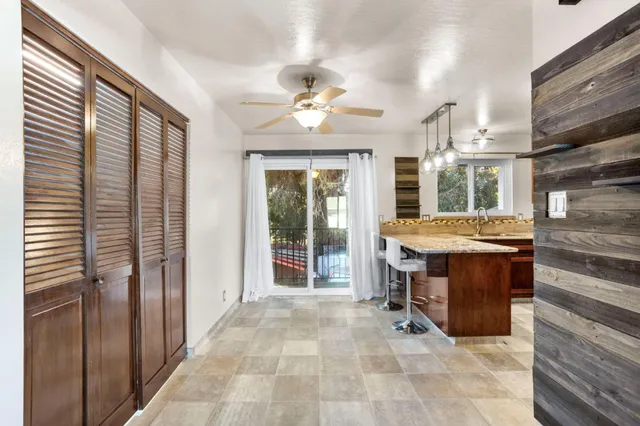 a view of living room kitchen and entryway