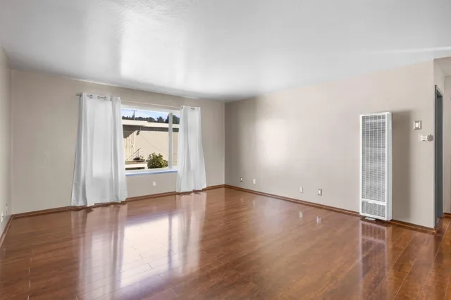 a view of an empty room and window