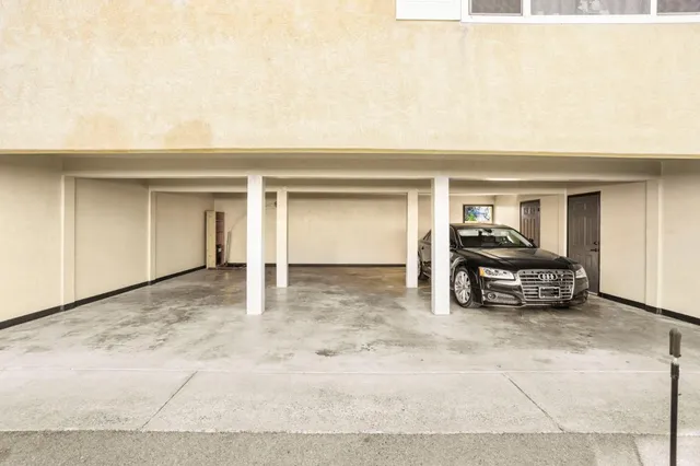 a view of garage with a car parked in garage
