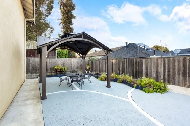 a view of a backyard with sitting area