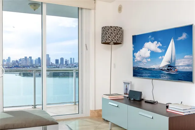 a kitchen with a sink cabinets and a wooden floor