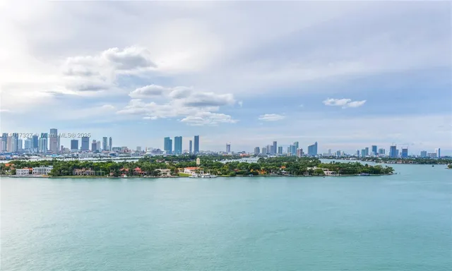 a view of a lake with a large building in the back
