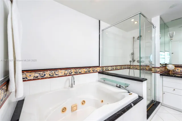 a bathroom with a bathtub and a sink