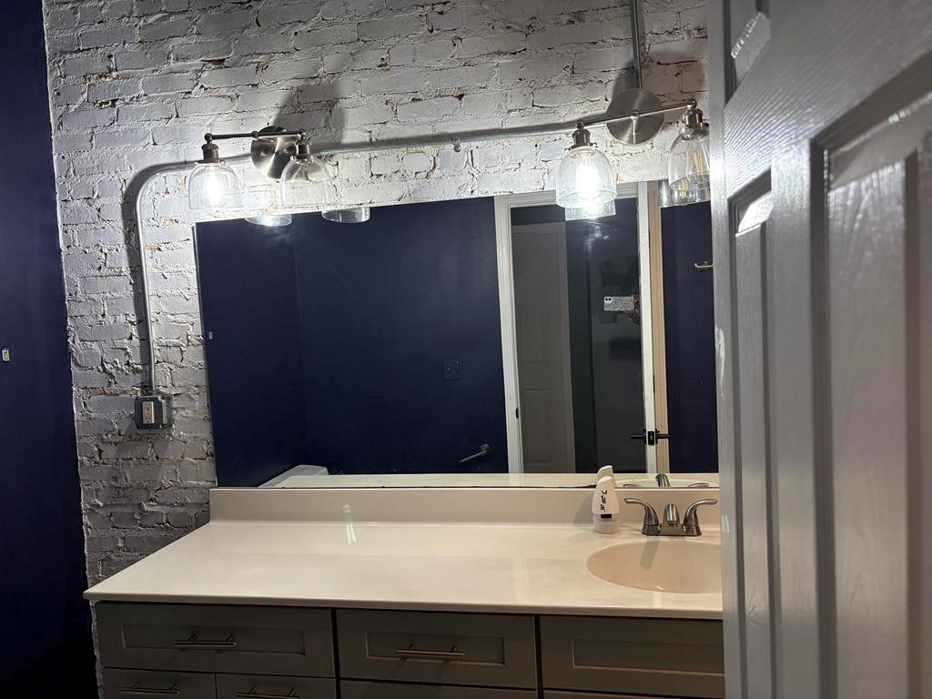 320 Martin Luther King Junior Drive Southeast, Unit 18A Atlanta, GA 30312 - Photo 13 of 15 a bathroom with a sink and a mirror