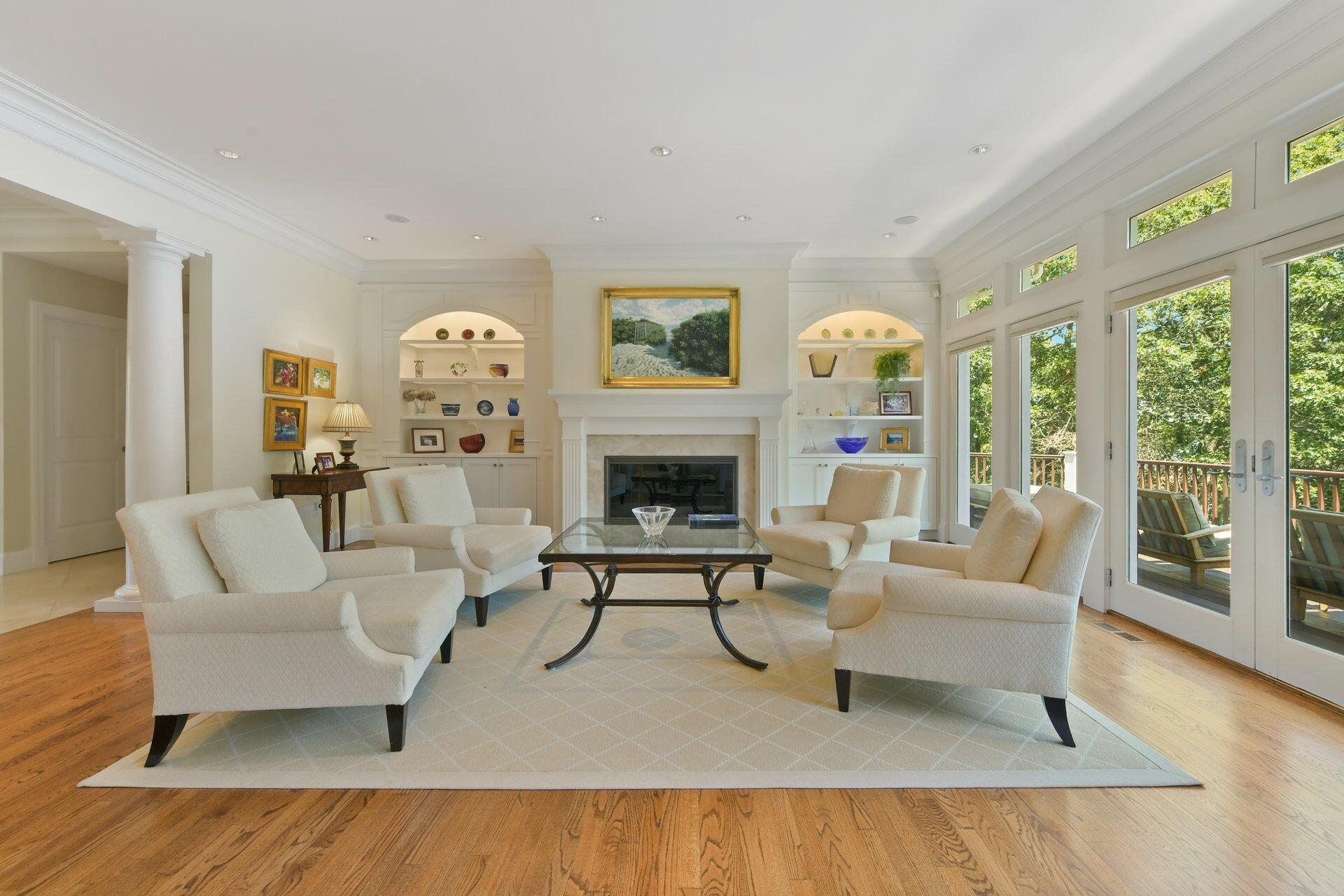 37 Shoestring Bay Road Mashpee, MA 02649 - Photo 11 of 42 a living room with furniture and a fireplace