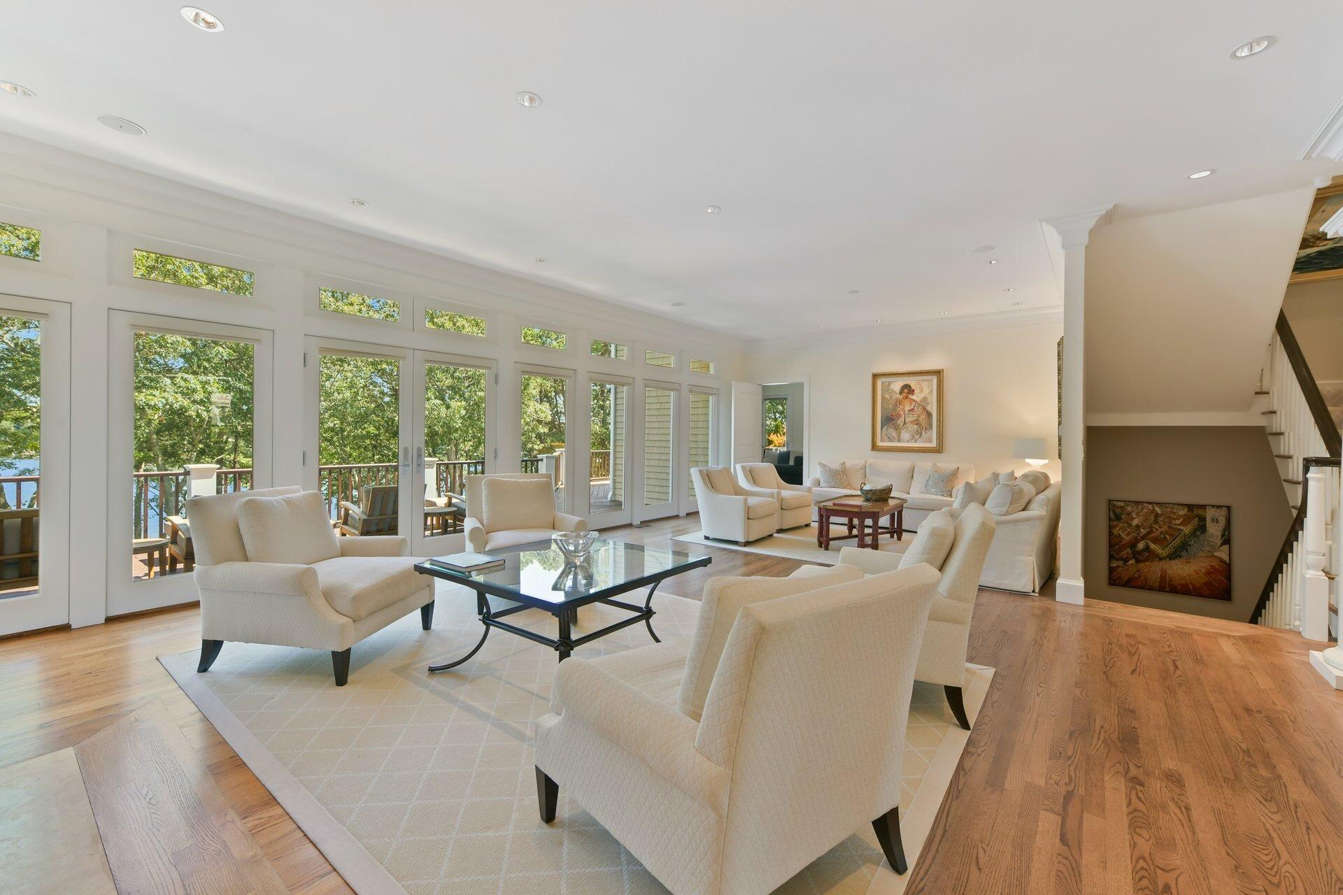 37 Shoestring Bay Road Mashpee, MA 02649 - Photo 12 of 42 a living room with fireplace furniture and a large window
