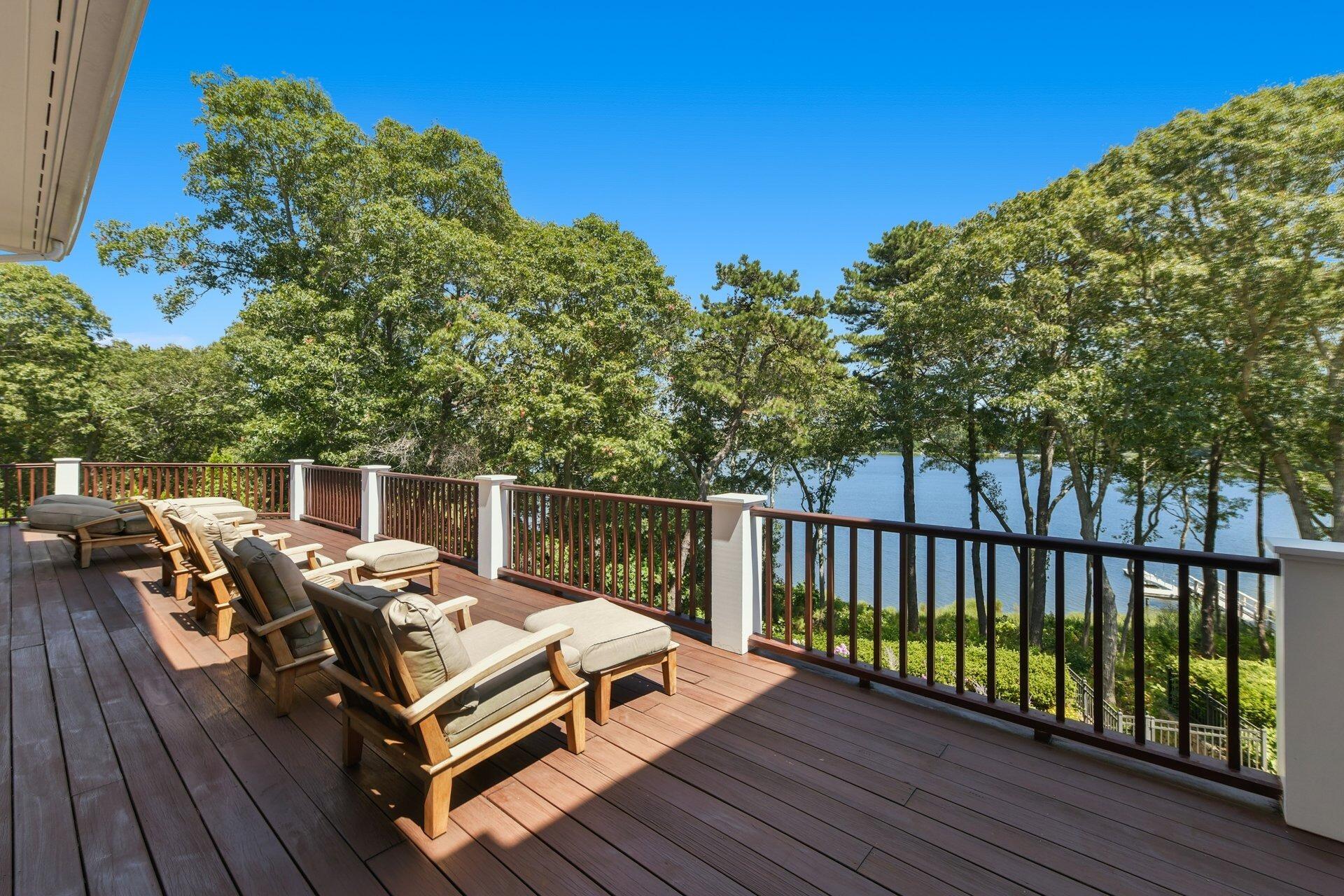 37 Shoestring Bay Road Mashpee, MA 02649 - Photo 13 of 42 a view of a wooden deck with furniture