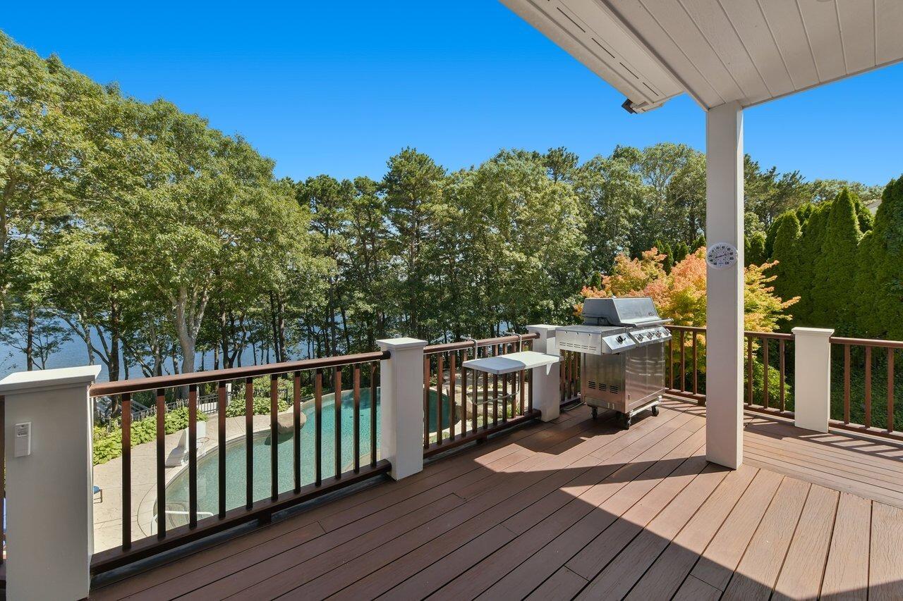 37 Shoestring Bay Road Mashpee, MA 02649 - Photo 14 of 42 a view of a balcony with wooden floor