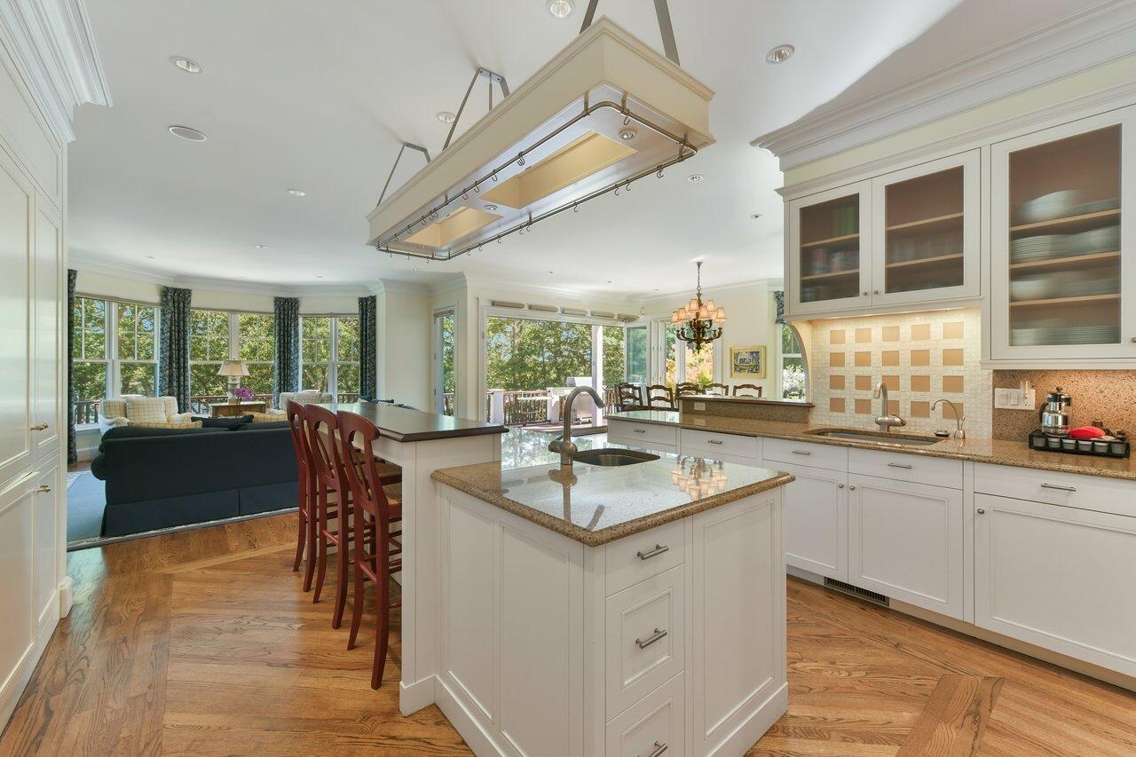 37 Shoestring Bay Road Mashpee, MA 02649 - Photo 18 of 42 a kitchen with counter top space appliances and a dining table