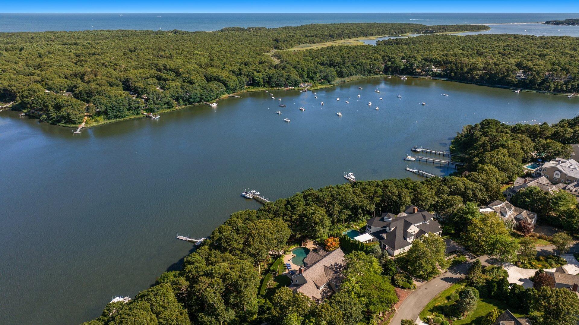 37 Shoestring Bay Road Mashpee, MA 02649 - Photo 2 of 42 an aerial view of a houses with a lake
