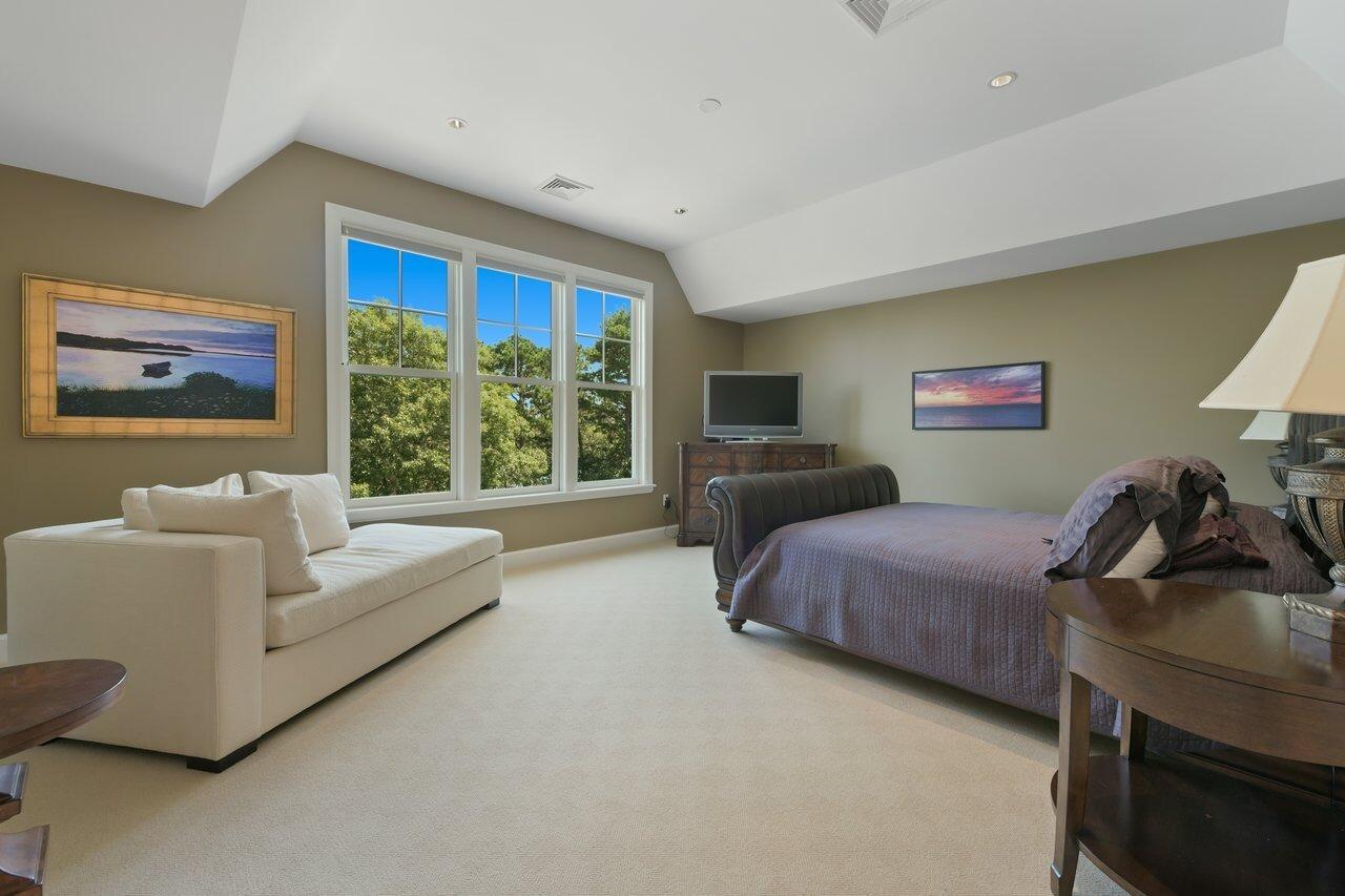 37 Shoestring Bay Road Mashpee, MA 02649 - Photo 26 of 42 a spacious bedroom with a bed and a couch