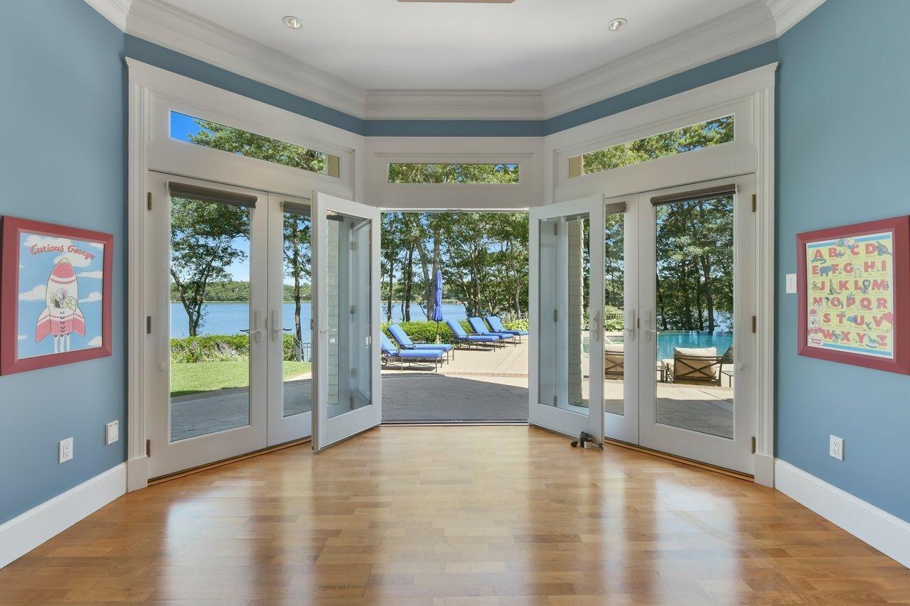 37 Shoestring Bay Road Mashpee, MA 02649 - Photo 33 of 42 an empty room with wooden floor and windows