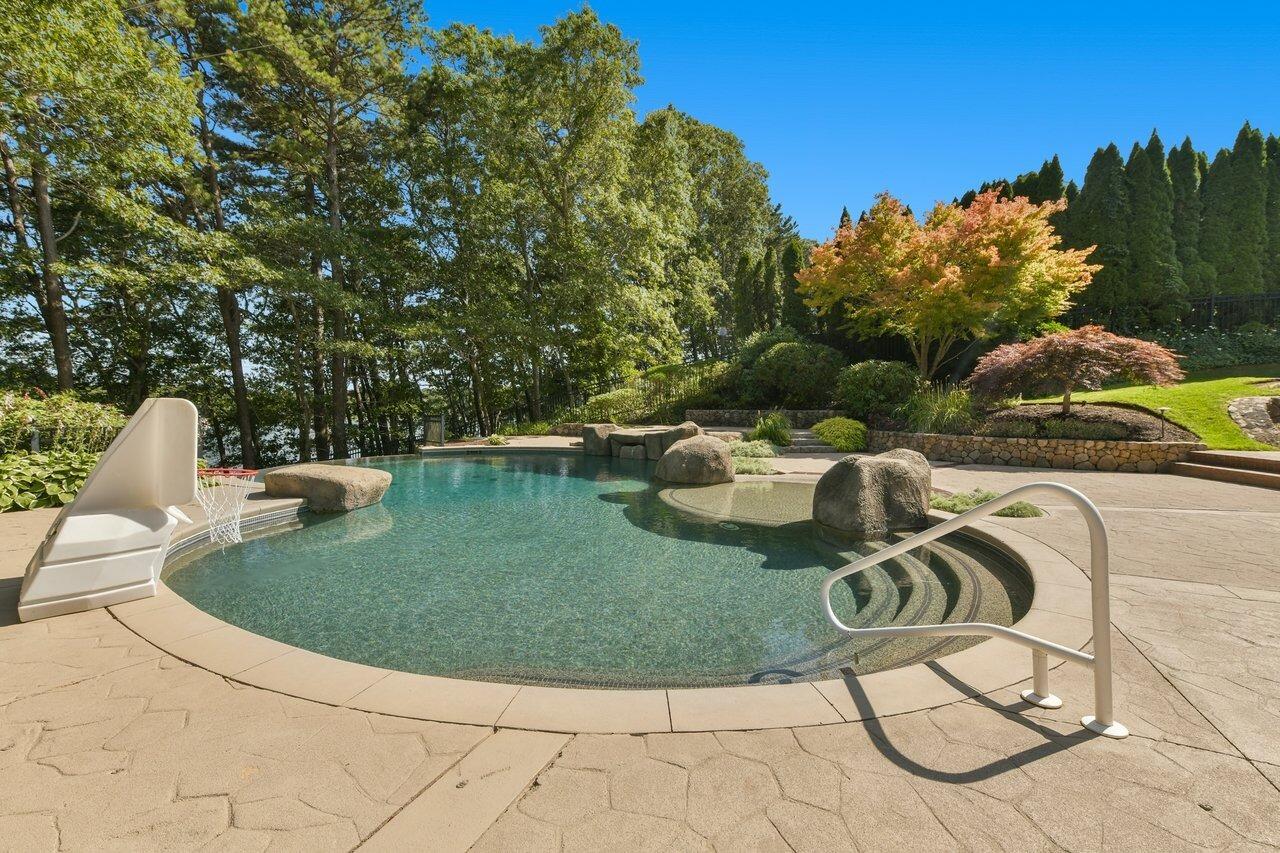 37 Shoestring Bay Road Mashpee, MA 02649 - Photo 34 of 42 a view of a swimming pool with lawn chairs