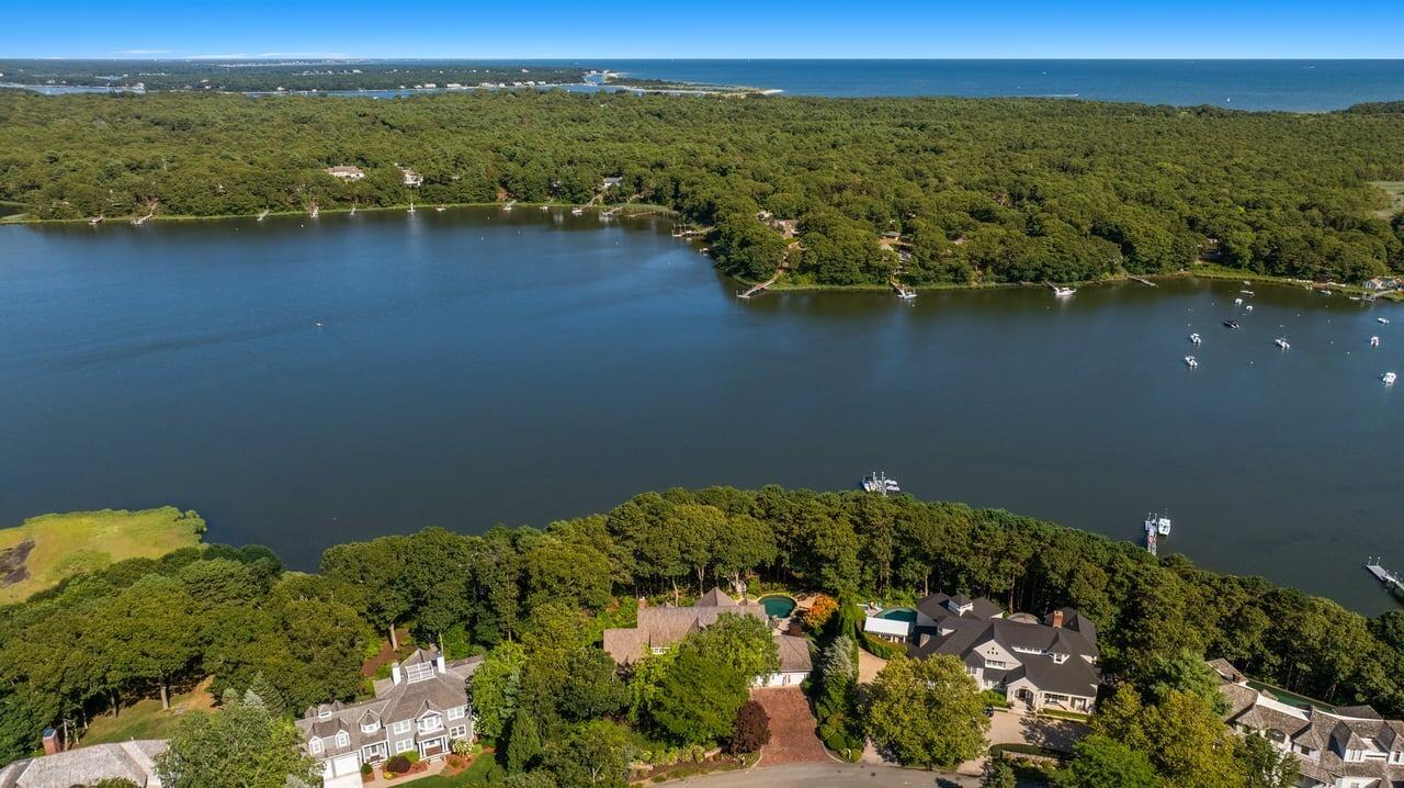 37 Shoestring Bay Road Mashpee, MA 02649 - Photo 35 of 42 a view of a lake with a mountain in the background
