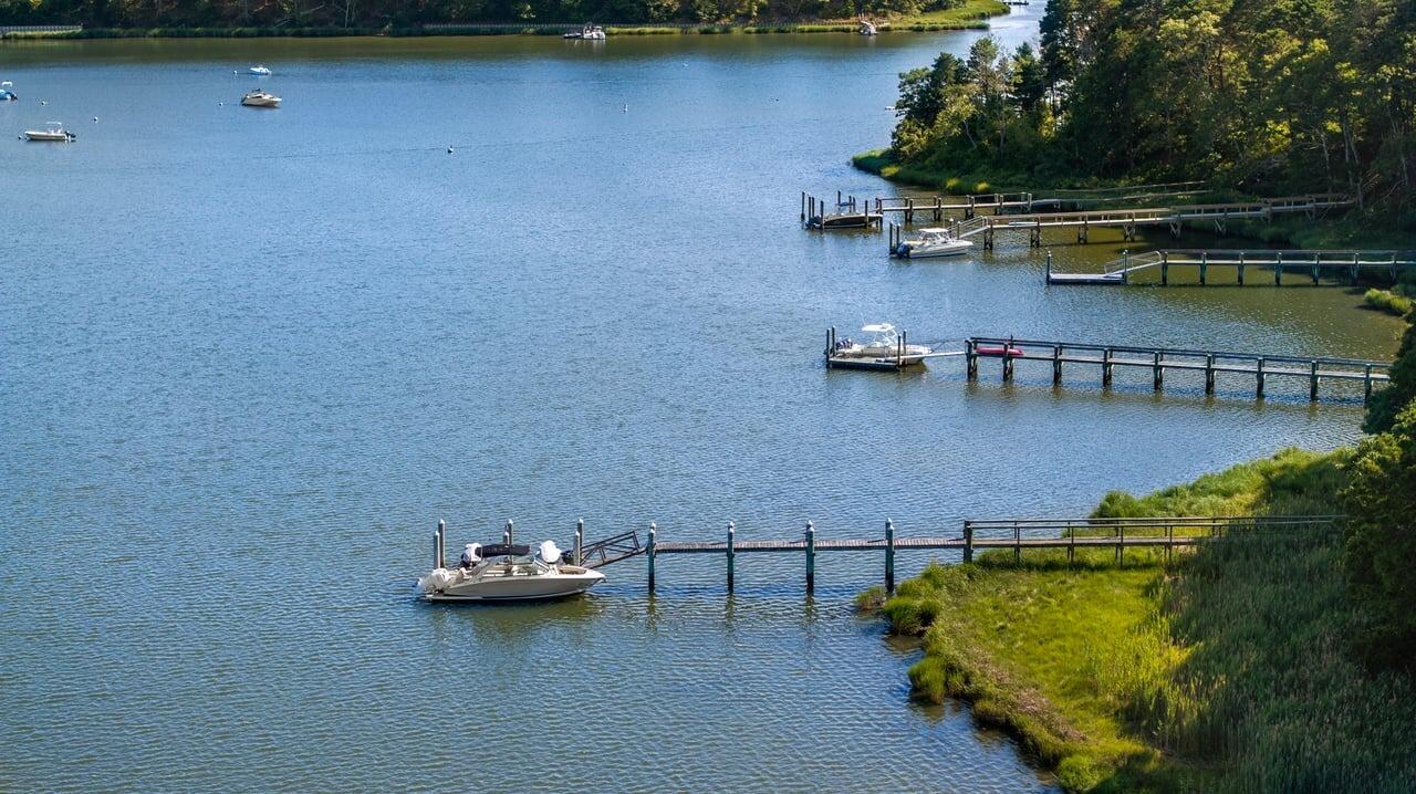 37 Shoestring Bay Road Mashpee, MA 02649 - Photo 36 of 42 a view of a lake with boats and trees