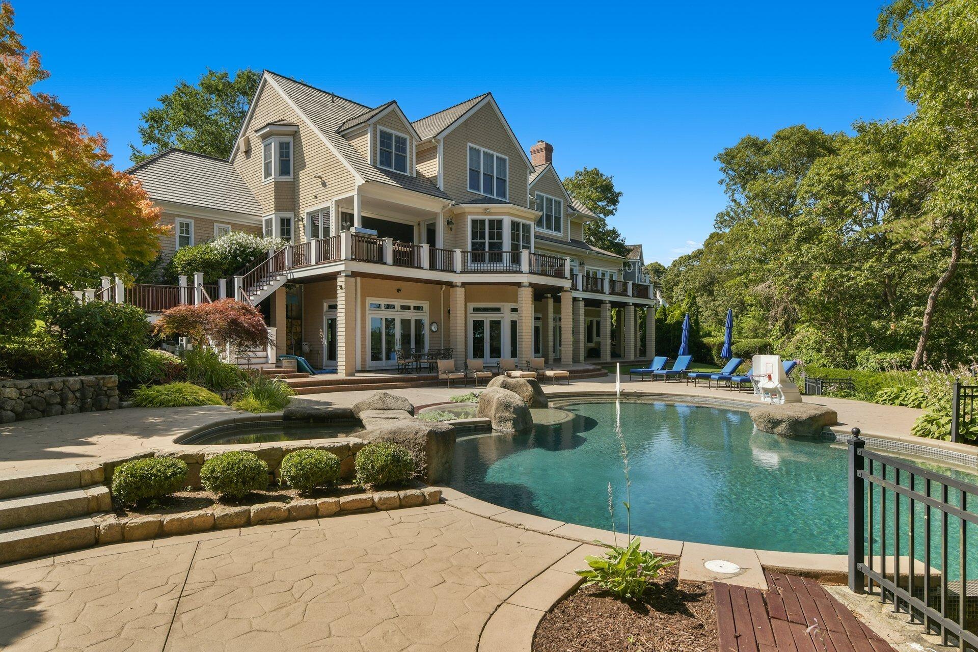 37 Shoestring Bay Road Mashpee, MA 02649 - Photo 6 of 42 a front view of a house with swimming pool having outdoor seating