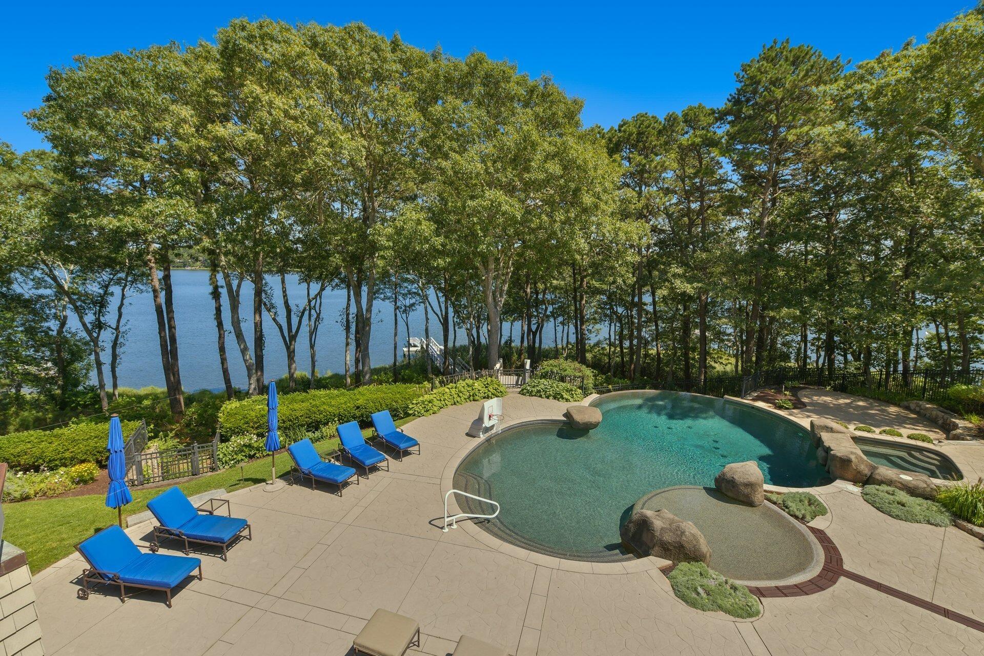 37 Shoestring Bay Road Mashpee, MA 02649 - Photo 7 of 42 a view of a backyard with plants and outdoor seating