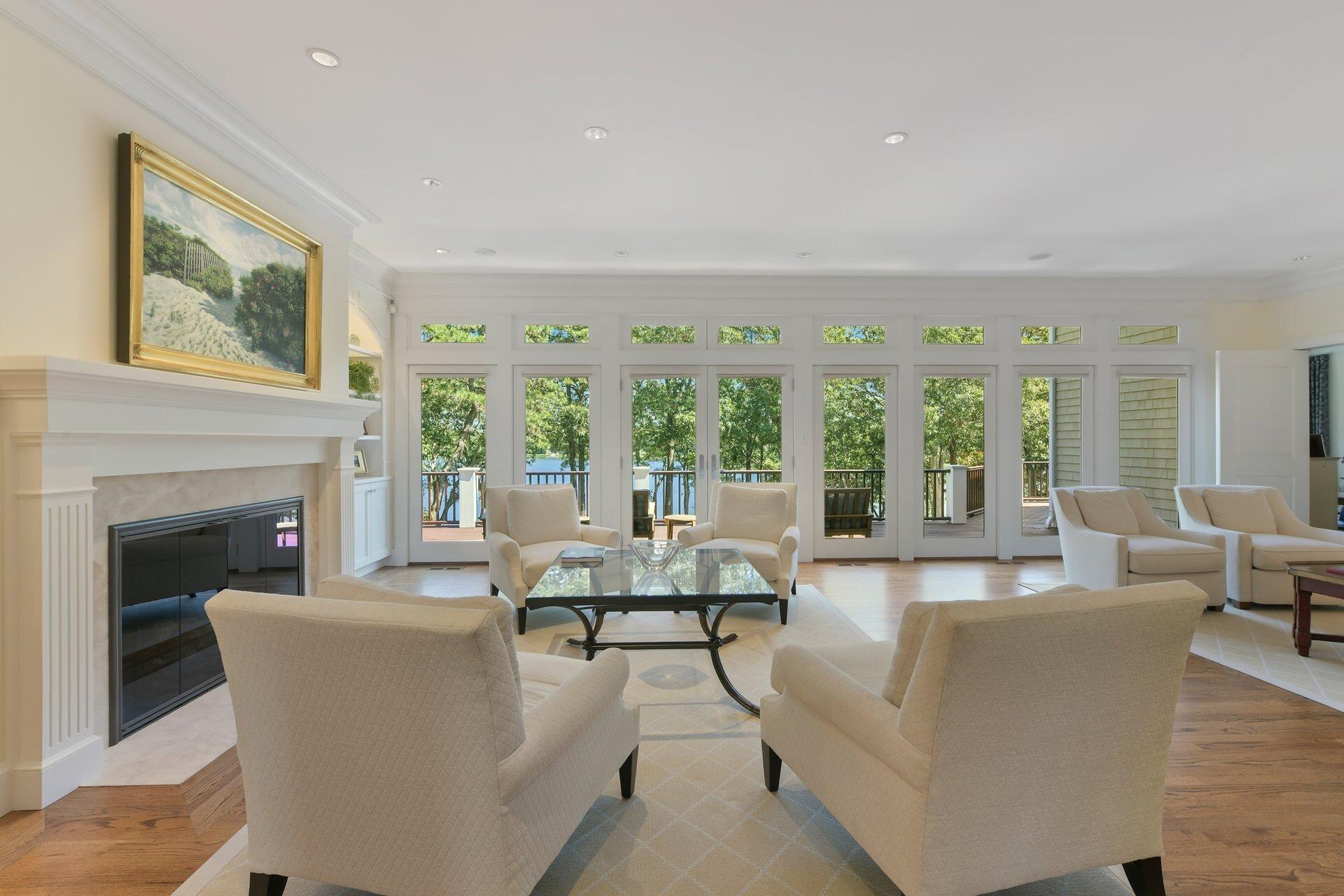 37 Shoestring Bay Road Mashpee, MA 02649 - Photo 10 of 42 a living room with furniture and a fireplace
