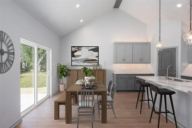 a dining room with furniture and window