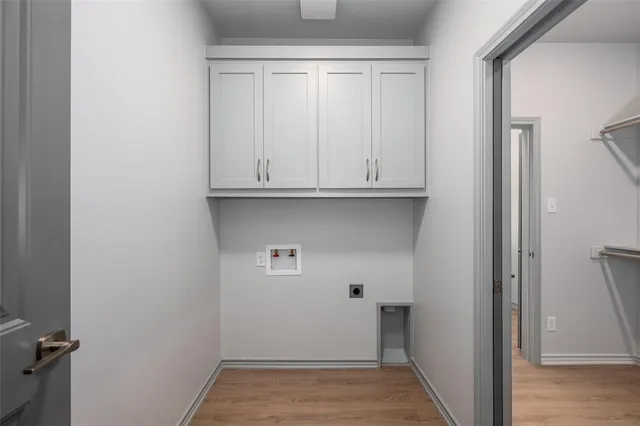 a view of cabinets and utility room