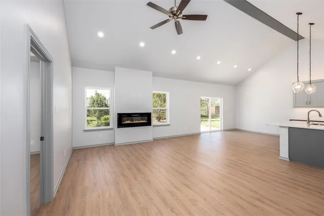 a view of a kitchen with a sink and a window