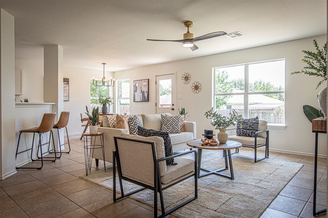 a living room with furniture and a large window