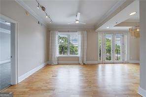 2255 Peachtree Road Northeast, Unit 620 Atlanta, GA 30305 - Photo 5 of 5 a view of an empty room with wooden floor and a window