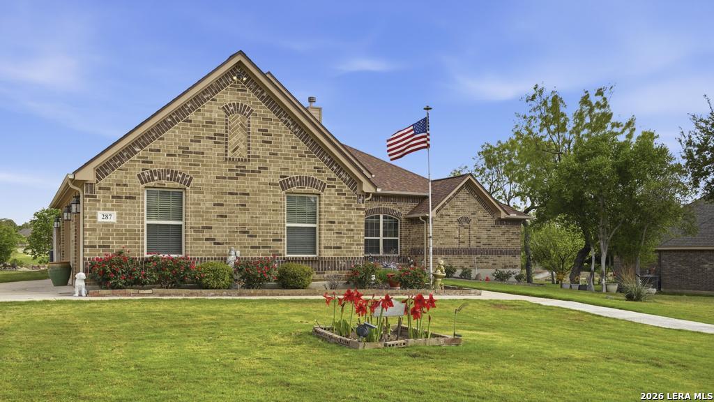 287 Cascade Trail Castroville, TX 78009 - Photo 1 of 46 a view of a house with a yard
