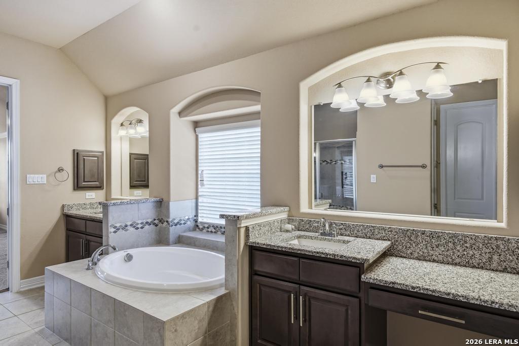 287 Cascade Trail Castroville, TX 78009 - Photo 22 of 46 a bathroom with a sink and a mirror