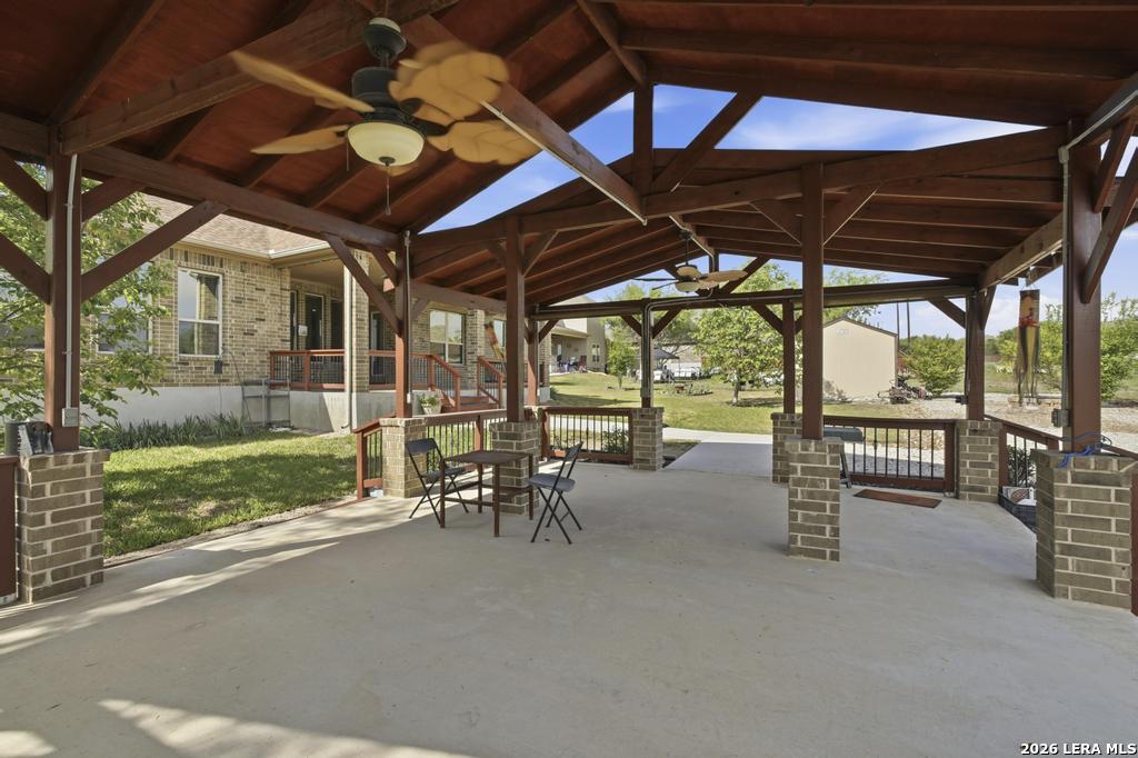 287 Cascade Trail Castroville, TX 78009 - Photo 40 of 46 a view of a porch with furniture and a yard