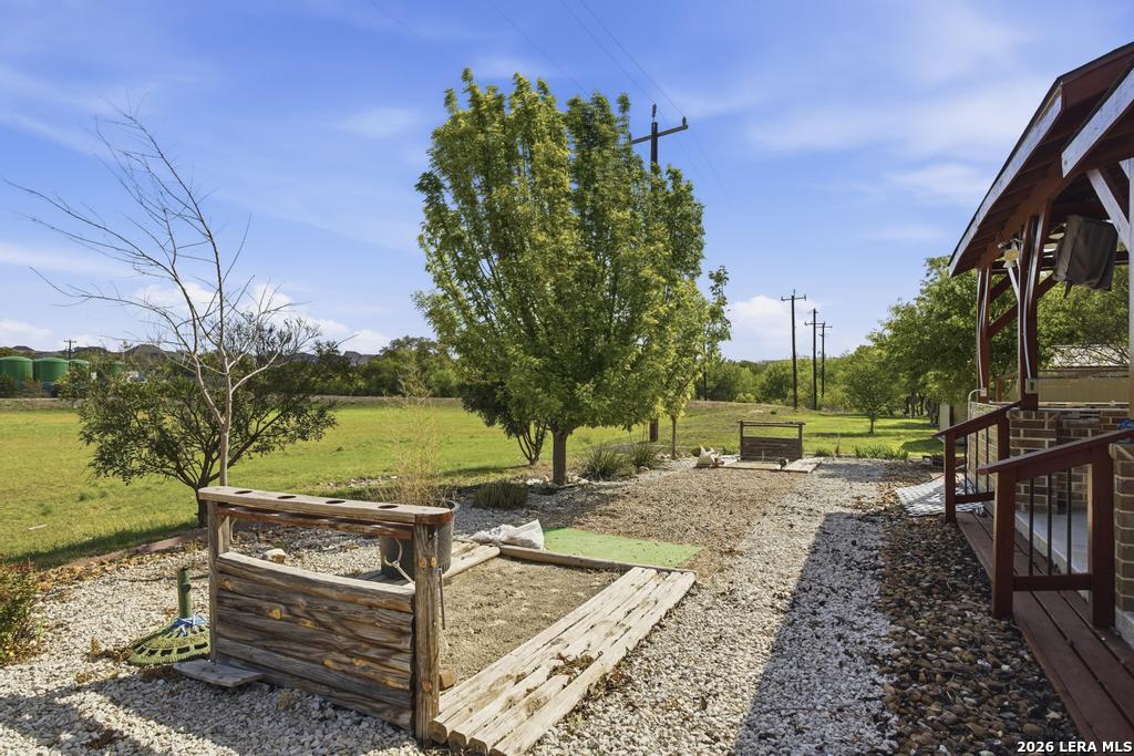 287 Cascade Trail Castroville, TX 78009 - Photo 43 of 46 a view of a backyard with sitting area