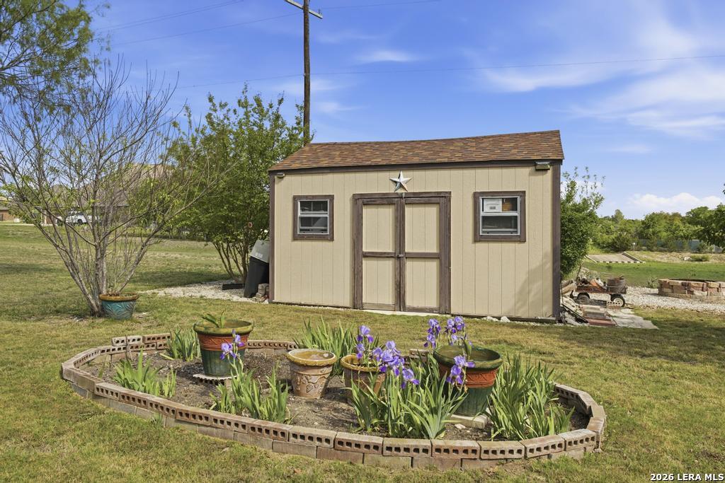 287 Cascade Trail Castroville, TX 78009 - Photo 44 of 46 a front view of a house with garden