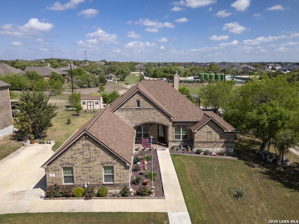 287 Cascade Trail Castroville, TX 78009 - Photo 45 of 46 a aerial view of a house next to a yard