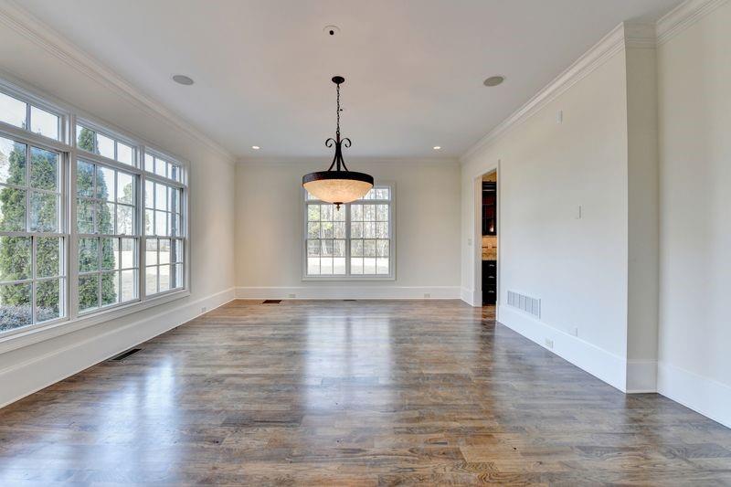 4045 Ridge Road Buford, GA 30519 - Photo 6 of 97 a view of an empty room with wooden floor and a window