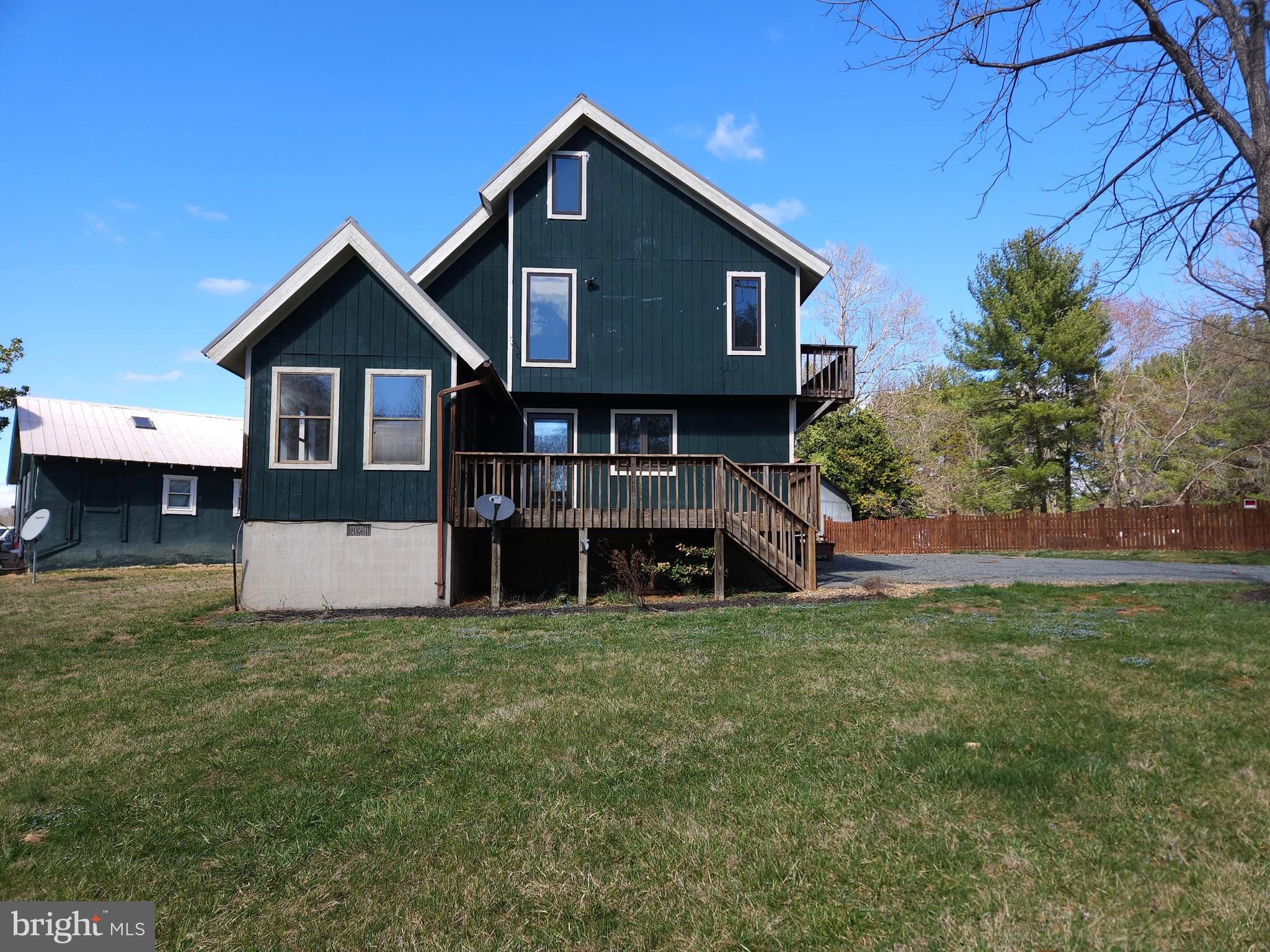 13256 Golden Drive Sumerduck, VA 22742 - Photo 1 of 27 a view of a house with a yard and sitting area
