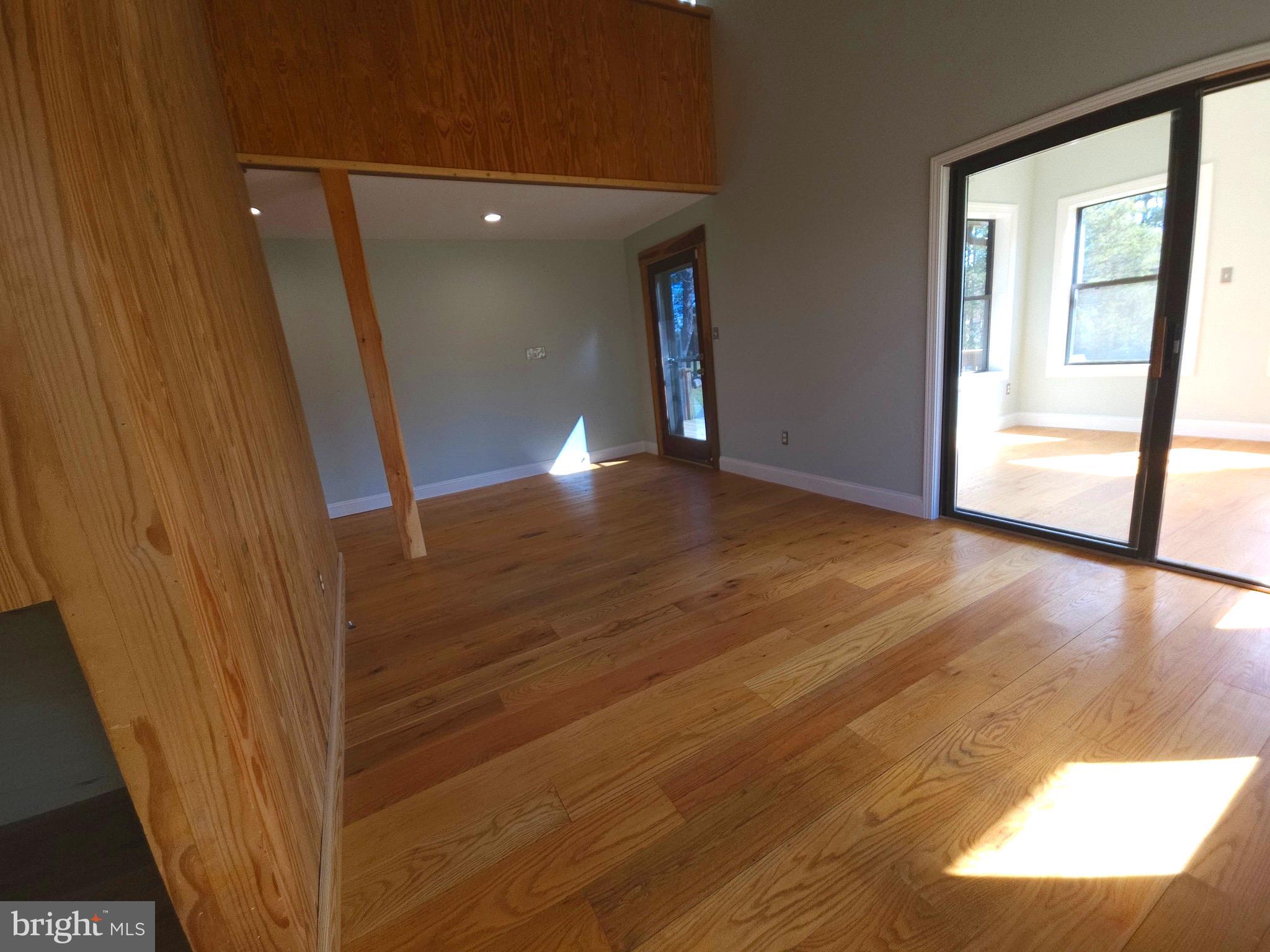 13256 Golden Drive Sumerduck, VA 22742 - Photo 11 of 27 a view of a hallway with wooden floor and staircase