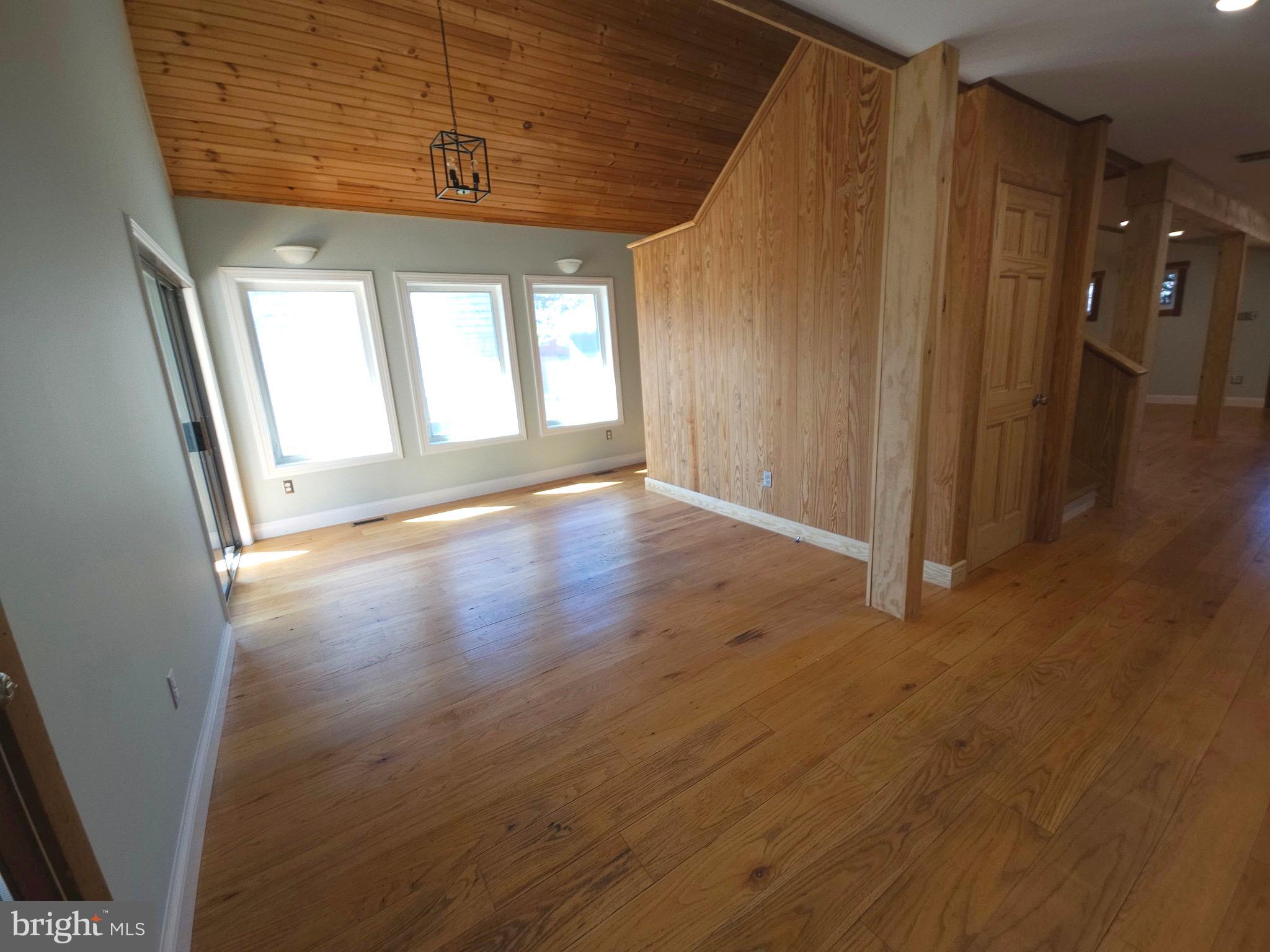 13256 Golden Drive Sumerduck, VA 22742 - Photo 12 of 27 an empty room with wooden floor and windows