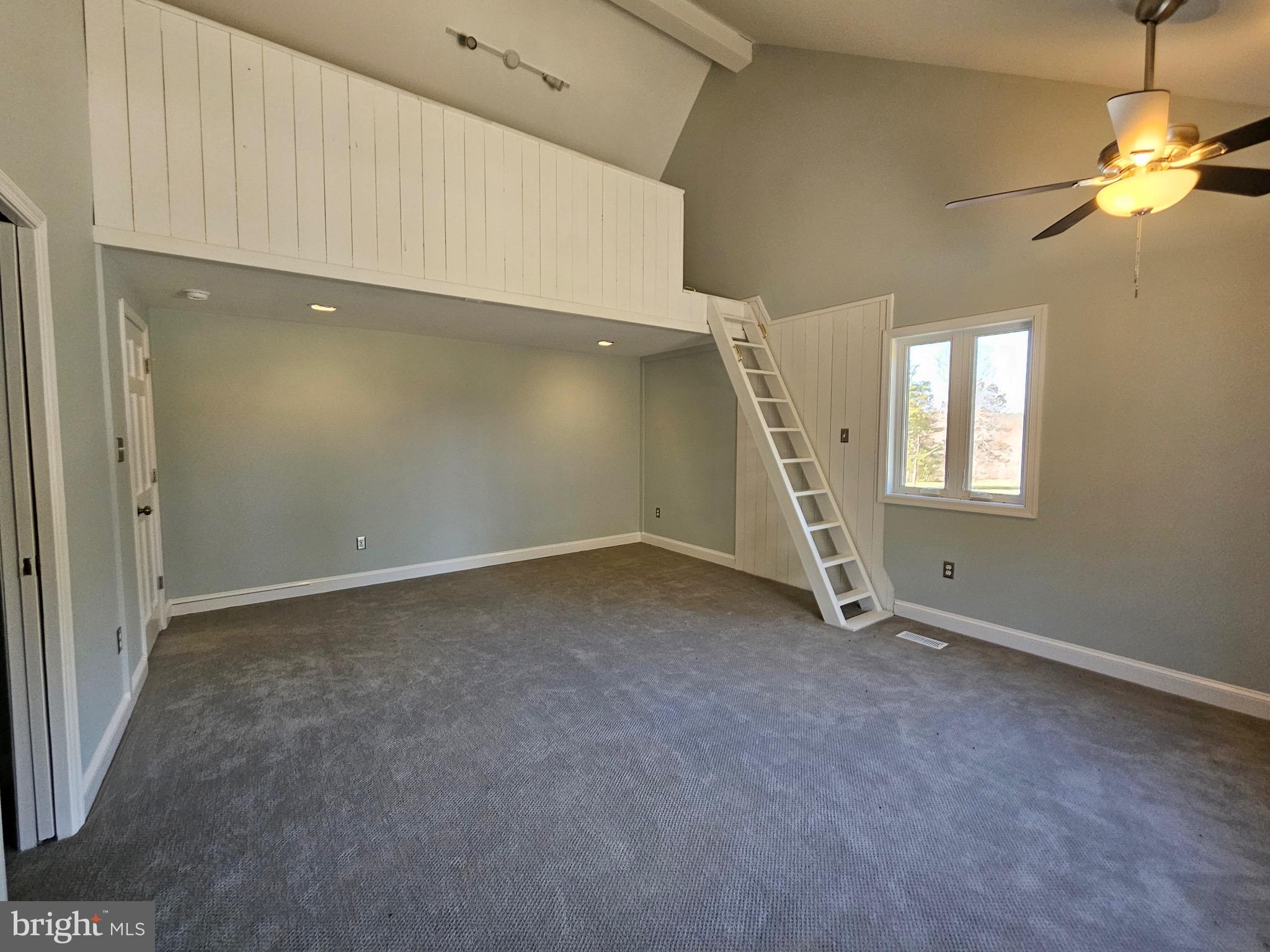 13256 Golden Drive Sumerduck, VA 22742 - Photo 26 of 27 an empty room with windows and stairs