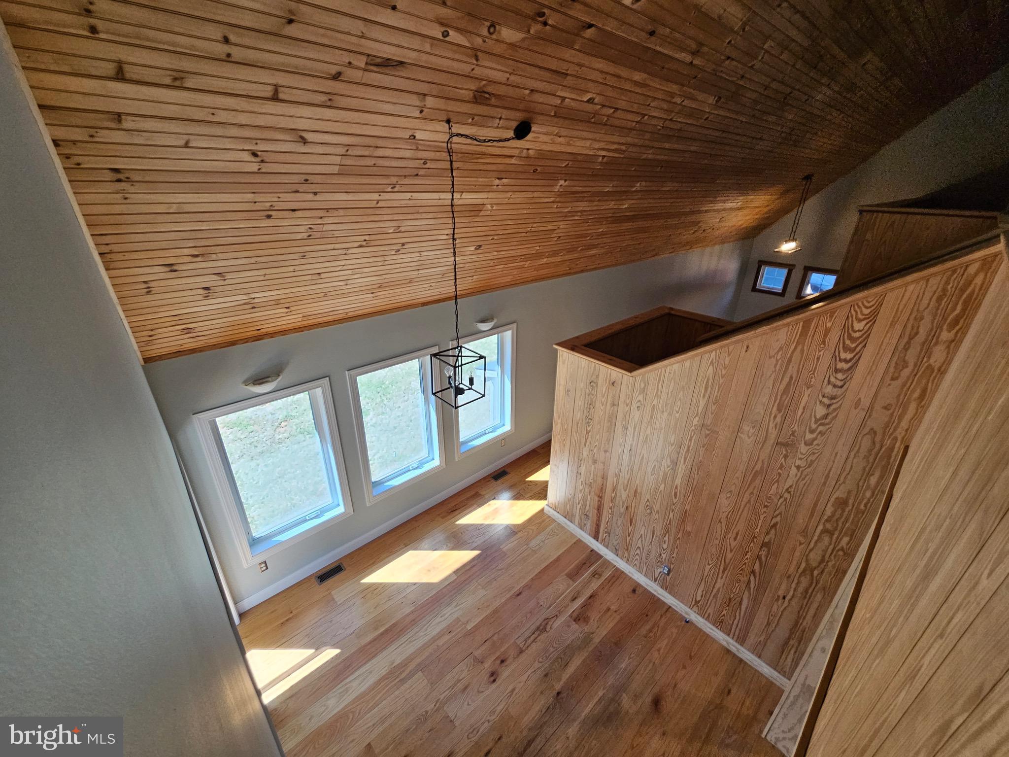 13256 Golden Drive Sumerduck, VA 22742 - Photo 27 of 27 a view of a hallway with wooden floor