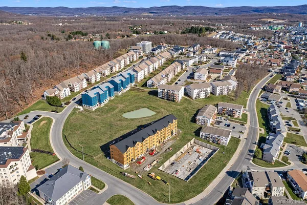 an aerial view of a residential houses and outdoor space