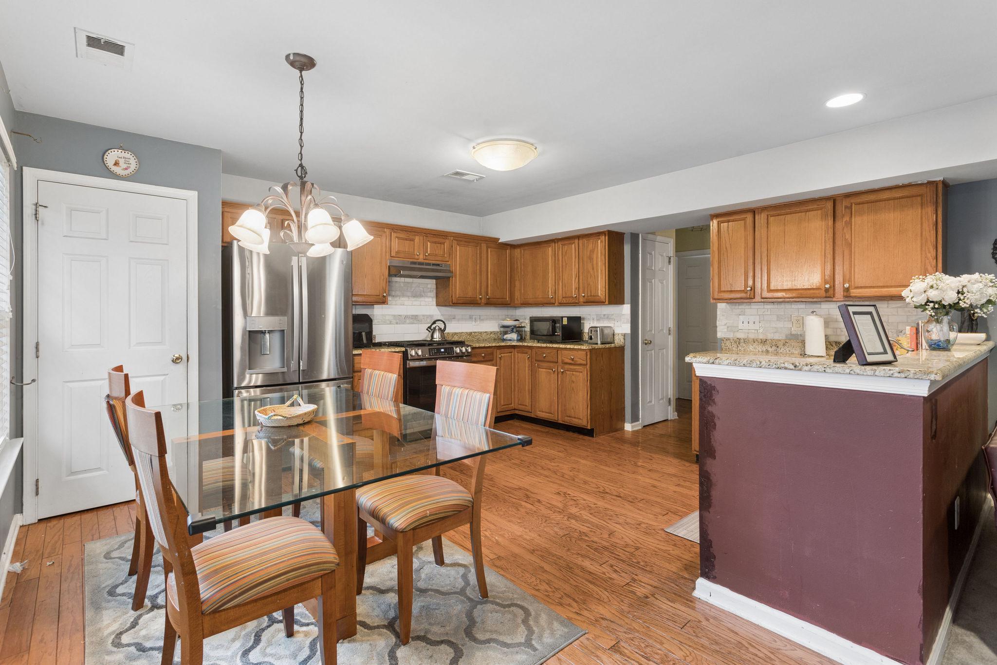 18 Hemingway Lane Columbus, NJ 08022 - Photo 14 of 27 Modern eat-in-kitchen with warm wood accents.