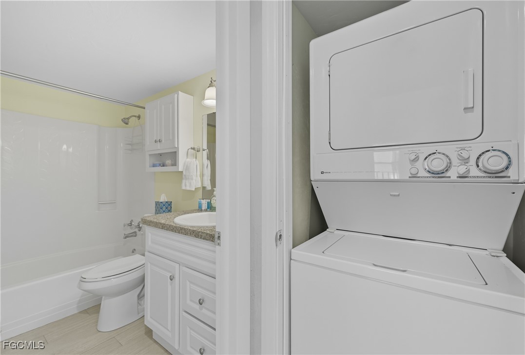 16881 Davis Road, Unit 126 Fort Myers, FL 33908 - Photo 14 of 27 a bathroom with a toilet sink and mirror