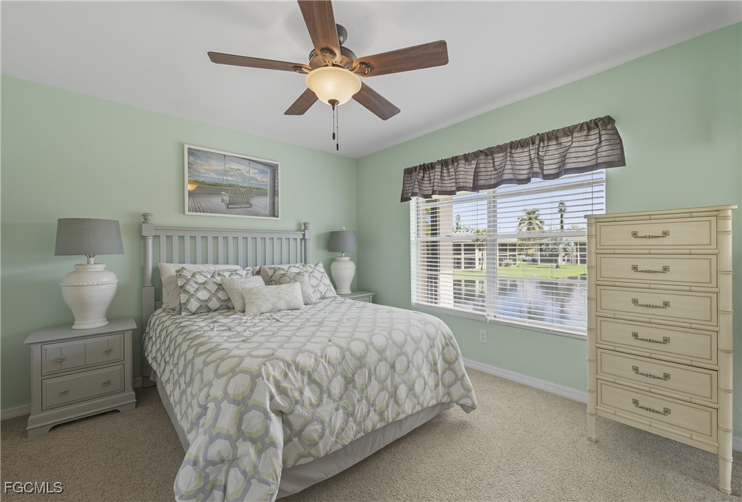 16881 Davis Road, Unit 126 Fort Myers, FL 33908 - Photo 15 of 27 a bedroom with a large bed and a window
