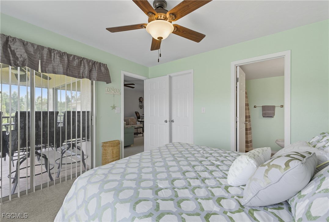 16881 Davis Road, Unit 126 Fort Myers, FL 33908 - Photo 17 of 27 a bedroom with a bed and a chandelier
