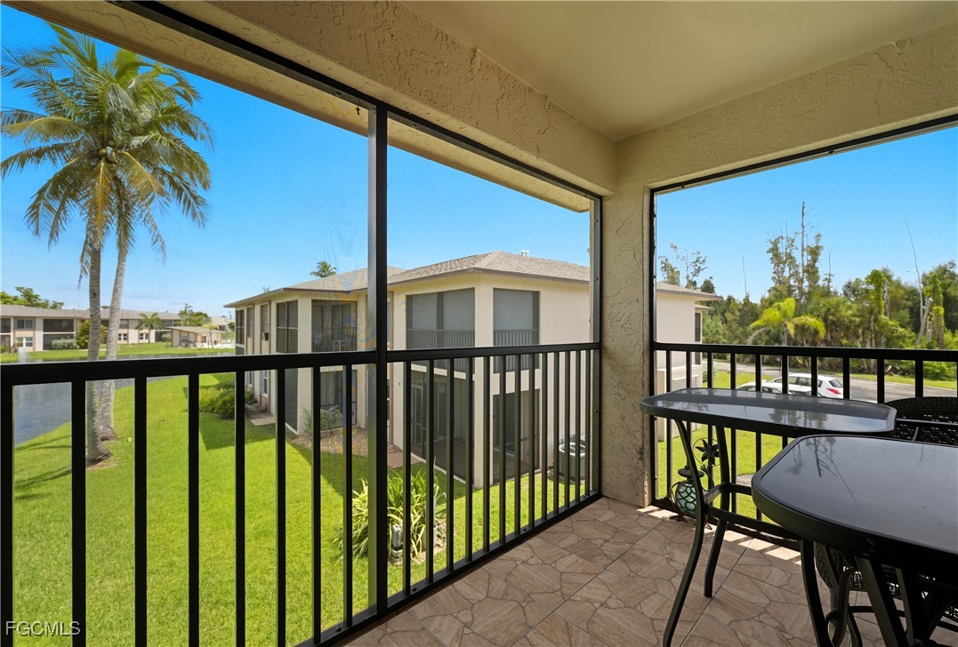 16881 Davis Road, Unit 126 Fort Myers, FL 33908 - Photo 22 of 27 a view of a balcony with lake view