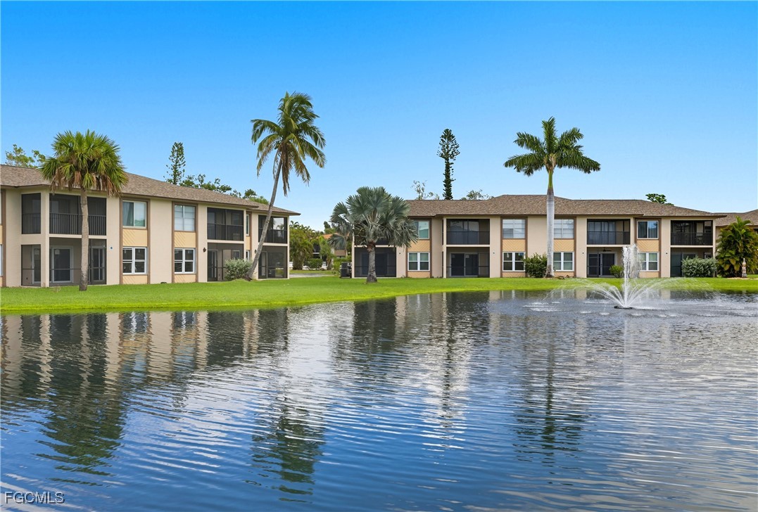 16881 Davis Road, Unit 126 Fort Myers, FL 33908 - Photo 24 of 27 a view of a house with a swimming pool