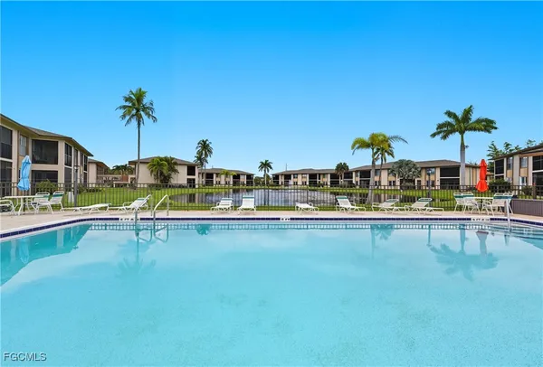 a view of swimming pool with outdoor seating
